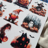 Zbliżenie na wydrukowany arkusz z halloweenowymi grafikami takimi jak dynie, duchy, czarownice.