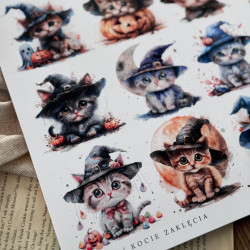 Zbliżenie na wydrukowany arkusz z 12 słodkimi halloweenowymi grafikami kotów,