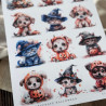 Zbliżenie na wydrukowany arkusz A4 z halloweenowymi pieskami i kotami w ciekawych kostiumach.